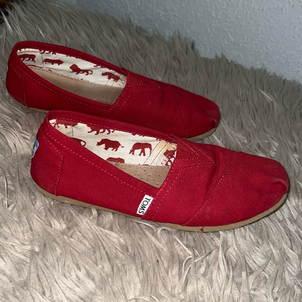 Tom’s Red, size Women’s 8 and a 1/2 shoes.